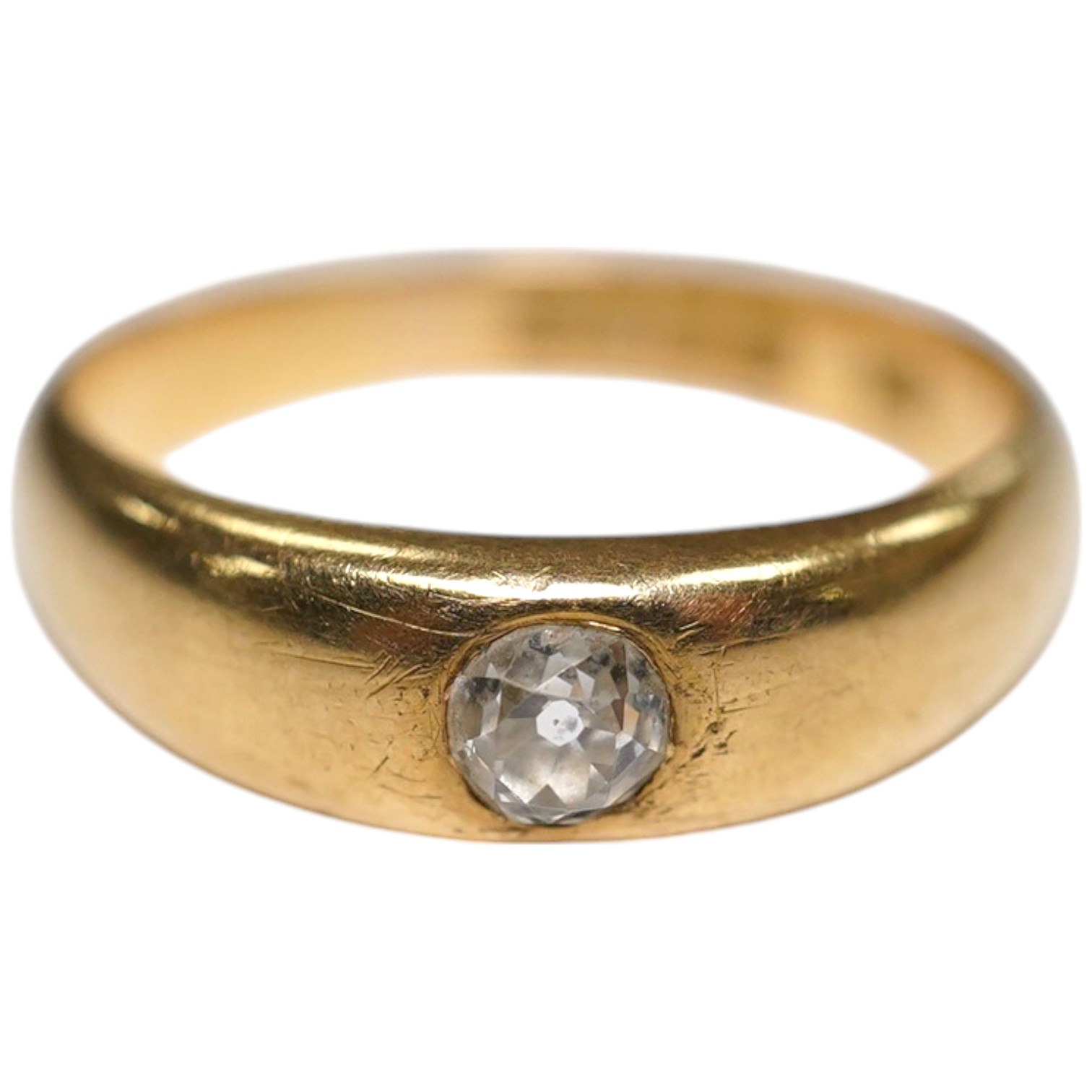 A late Victorian 18ct gold and single stone gypsy set diamond ring, size P, gross weight 5.3 grams. Condition - fair